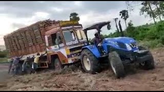 New Holland 9010 4wd tractor pulling overloaded truck  90hp  Tractorkaran [upl. by Jonati]