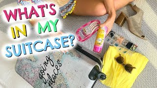 WHAT I PACK IN MY SUITCASE amp MY TRAVEL ESSENTIALS  PACK WITH ME  EMILY NORRIS AD [upl. by Synn]