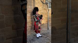 A bagpiper busking with the Great Highland bagpipe on the street in Edinburgh Scotland shorts [upl. by Kask804]