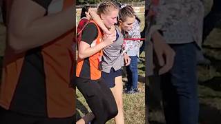 Arkansas high school runner helps competitor cross the finish line [upl. by Atiken]