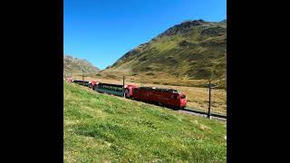 Glacier Express at Oberalp Pass in Swiss Alps Matterhorn Gotthard Bahn [upl. by Naomi]