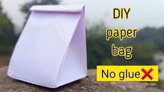 Origami paper bagHow to make paper bag without glueNo glue paper craftDIY gift bagNo glue bax [upl. by Ylahtan]