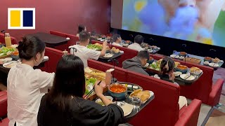 Moviegoers indulge in growing trend of ‘hotpot cinema’ [upl. by Ilojne]