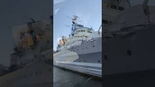 HMS Belfast battleship on the River Thames next to tower Bridge opposite tower of London [upl. by Aindrea839]