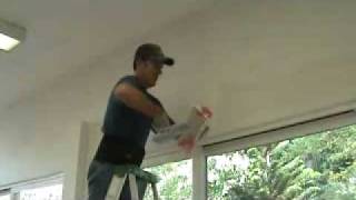 Applying a skim coat layer of drywall mud to a bullnose corner edge [upl. by Pascale]