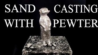 easy metal casting pouring liquid pewter into sand mold [upl. by Birmingham]