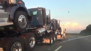 BRAND NEW 2013 KENWORTH SEMI TRUCKS BEING DELIVERED BY 1 DRIVER PIGGY BACK [upl. by Tnilk]