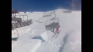 Snowboarder Knocks Skier Off Chairlift [upl. by Aitercal443]