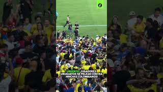 JUGADORES URUGUAYOS se pelean con HINCHAS COLOMBIANOS tras la ELIMINACIÓN de URUGUAY  Depor [upl. by Zonnya]