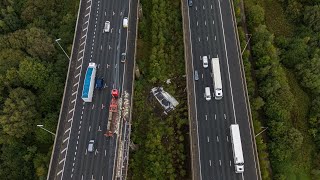 Shocking footage shows aftermath of lorry that plummeted off motorway bridge  SWNS [upl. by Gerfen]