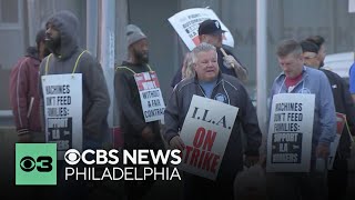 Dockworkers hit the picket line in Philadelphia as port strike starts along the East and Gulf coasts [upl. by Llerrej]