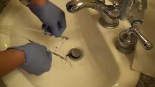 Cleaning a Hair Clog from a Sink using a ZipItlike Homemade Device [upl. by Sosthenna]