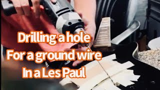 Drilling for a ground wire in a Les Paul style guitar with bridge and stop tailpiece [upl. by Dickson511]