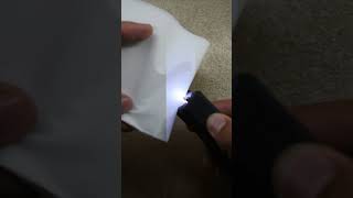 Stun gun on paper slight burn marks minimal effect shortsvideo paper stungunvoltage edc [upl. by Piscatelli]