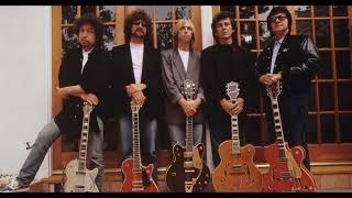 The Traveling Wilburys  Handle With Care  Lyrics [upl. by Loren23]