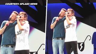 Watch Liam Payne KISSES Louis Tomlinson Accidentally On Stage [upl. by Llyrad965]