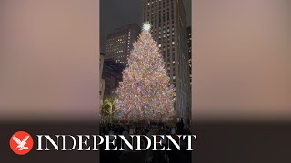 New York Citys 80 foot Christmas tree lights up [upl. by Ydennek]