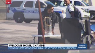 Texas Rangers Marcus Semien brings World Series trophy off plane at Dallas Love Field [upl. by Rutherfurd]