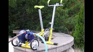 GREEN FLYWHEEL SPRINKLE BIKE AS A TOOL FOR IRRIGATION AND WATERING OF GARDEN [upl. by Aissatsana769]