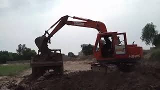 Excavator Digging Mud  Powerful Machine Tackles Tough Terrain [upl. by Neeven244]