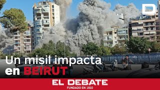 El momento en el que un misil de Israel derrumba un edificio de más de 10 plantas en Beirut [upl. by Ackler572]