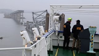 Recovery crews clearing metal debris from the site of the bridge collapse [upl. by Fisher]