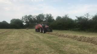 NEW HOLLAND G170 WITH MASSEY FERGUSON 2170 BIG BALER [upl. by Eatnuahs]