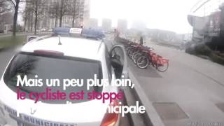 Un cycliste manque de se faire renverser par une voiture et se fait alpaguer par la police [upl. by Okiruy315]