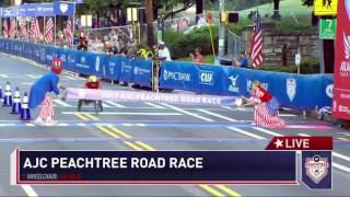 Winner Daniel Romanchuk crosses the finish line at the AJC Peachtree Road Race [upl. by Murrell]