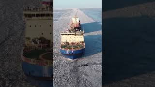 Icebreaker ship clearing icy water for other cargo ships [upl. by Lanahtan]