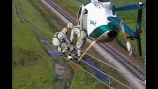 Helicopter Transfering Lineman to Wire [upl. by Yenffit899]