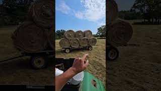 Racing the rain We are trying to get all these round bales moved [upl. by Eislel]