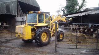 Massey Ferguson 50e  with silage grab  feeding cattle [upl. by Cordle]