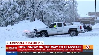 Kids play in snow while crews keep roads clear in Flagstaff area [upl. by Ahsenyl]