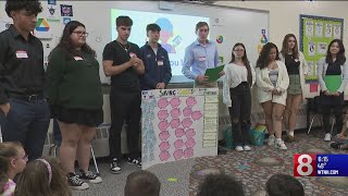 Newington high school students teach elementary schoolers finance [upl. by Okeim]