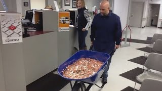 Man Pays Nearly 3000 Bill Using A Wheelbarrow Full Of Pennies [upl. by Yezdnil5]