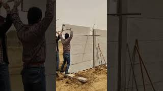 Workers are installing cement wall panels [upl. by Eimac]