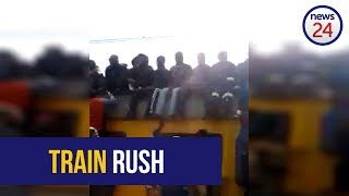 WATCH Commuters risk lives on overcrowded Metrorail train [upl. by Otsenre]