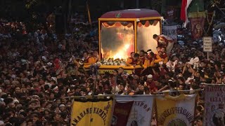 Philippine Catholics swarm Christ icon in mass parade  AFP [upl. by Suirrad863]