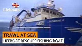 Lifeboat rescues large fishing vessel in rough seas [upl. by Ameluz]