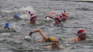 Swimmers brave annual Christmas Day race in Londons Serpentine [upl. by Llerrat]