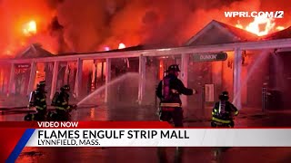 Video Now Flames engulf strip mall in Massachusetts [upl. by Tierney841]