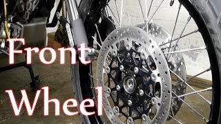 Tiger 800  Front wheel removal inspection  refit [upl. by Nosnej]