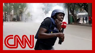 CNN reporter hit by fragment of tear gas canister while reporting on Kenya protests [upl. by Caniff]