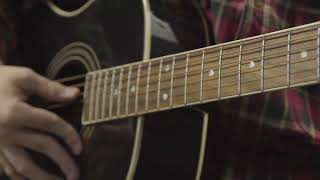 Tracking Shot Down Fret Board of Acoustic Guitar as Musician Tunes Strings [upl. by Htenay]