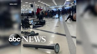 Accidental gun discharge sparks panic at Atlanta airport l GMA [upl. by Alleuqahs632]