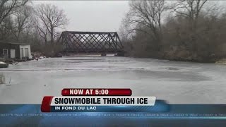 Snowmobile goes through ice in Fond Du Lac [upl. by Nyltiak843]