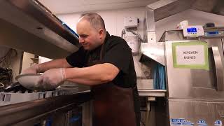 THE DISHWASHER WASHING DISHES WEARING A BLACK SHIRT AND A BROWN APRON MINIMUM WAGE WORK 74 [upl. by Daney126]