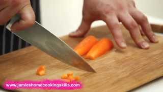 Chopping a carrot  Jamie Olivers Home Cooking Skills [upl. by Edahc744]