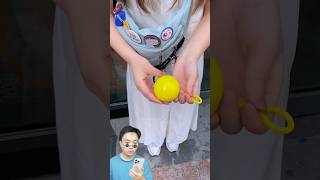 Fun Review on Outdoor Portable Raincoat Ball Disposable Rainwear Keychain [upl. by Kedezihclem]